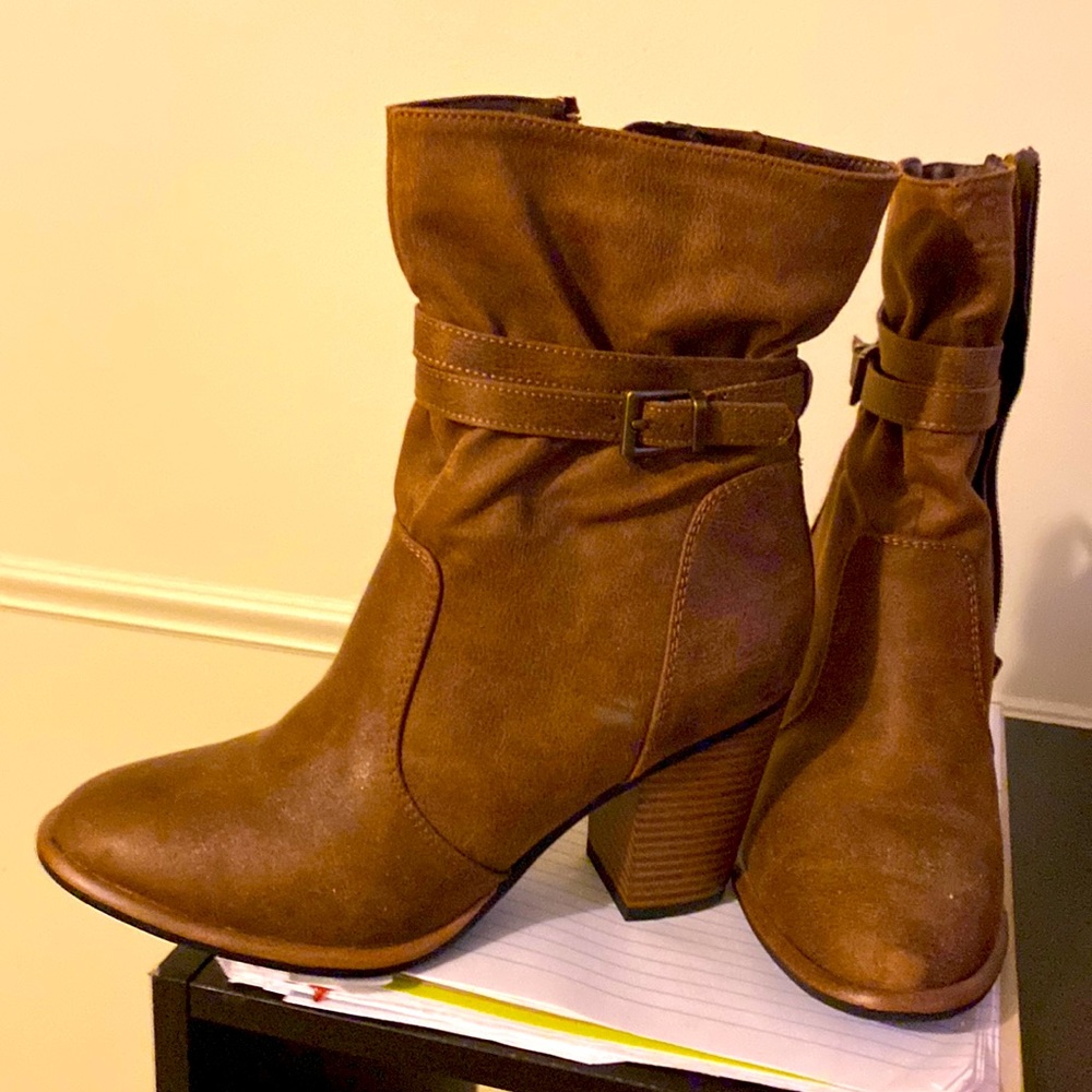 Size 6.5 womens leather, brown heeled boots. With adjustable buckle.